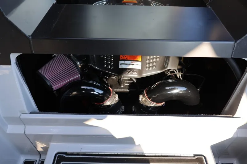 Slide: The Image of Engine compartment of 2026 Tigé Ultré 25ZX boat, showcasing air filters and components. - 67