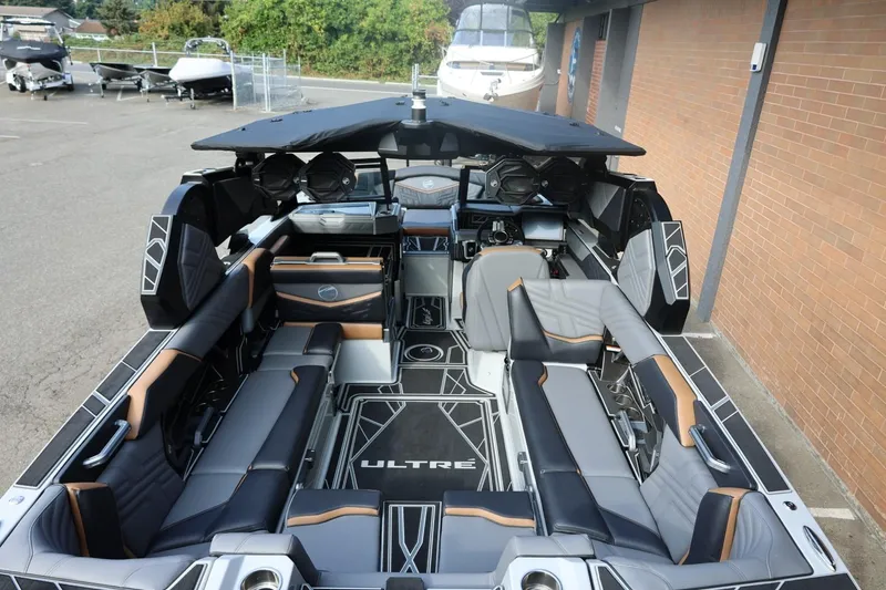 Slide: The Image of 2026 Tigé Ultré 25ZX boat interior with luxurious seating and modern design. - 69