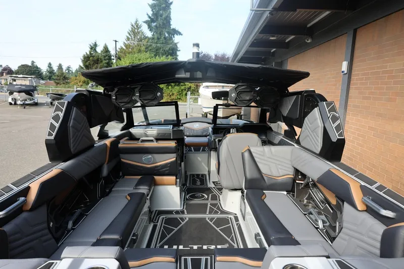 Slide: The Image of 2026 Tigé Ultré 25ZX boat interior with modern seating and advanced audio system. - 70