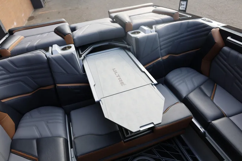 Slide: The Image of Luxurious interior of 2026 Tigé Ultré 25ZX boat with sleek seating and table. - 71