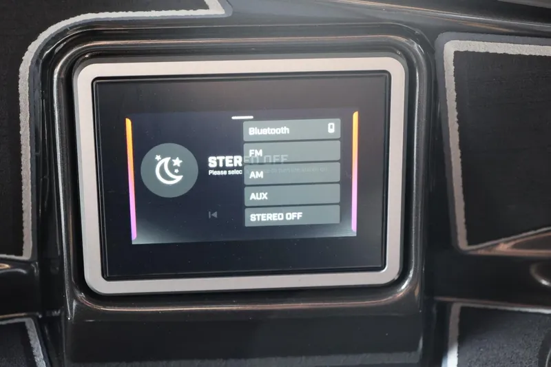 Slide: The Image of Touchscreen display in 2026 Tigé Ultré 25ZX boat showing stereo options. - 74