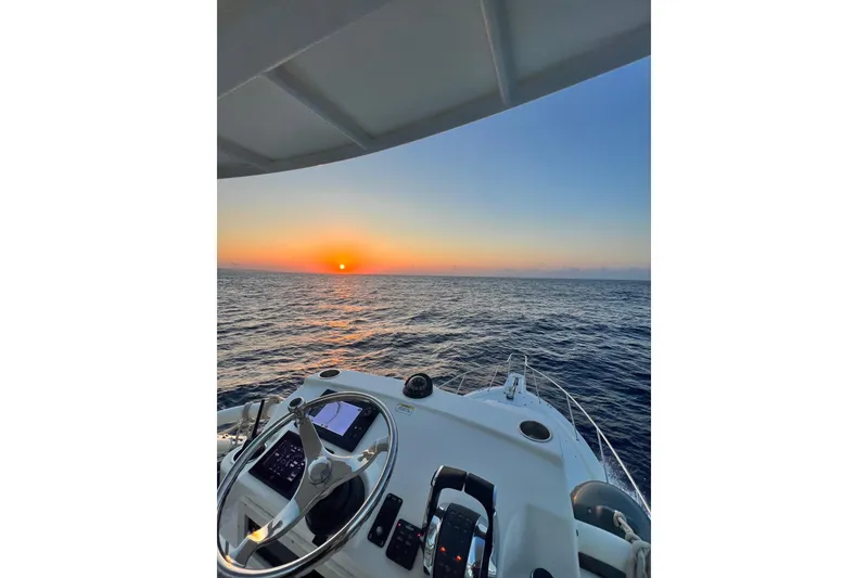 Slide: The Image of Boston Whaler 345 Conquest 2018 at sea during a stunning sunset. - 8