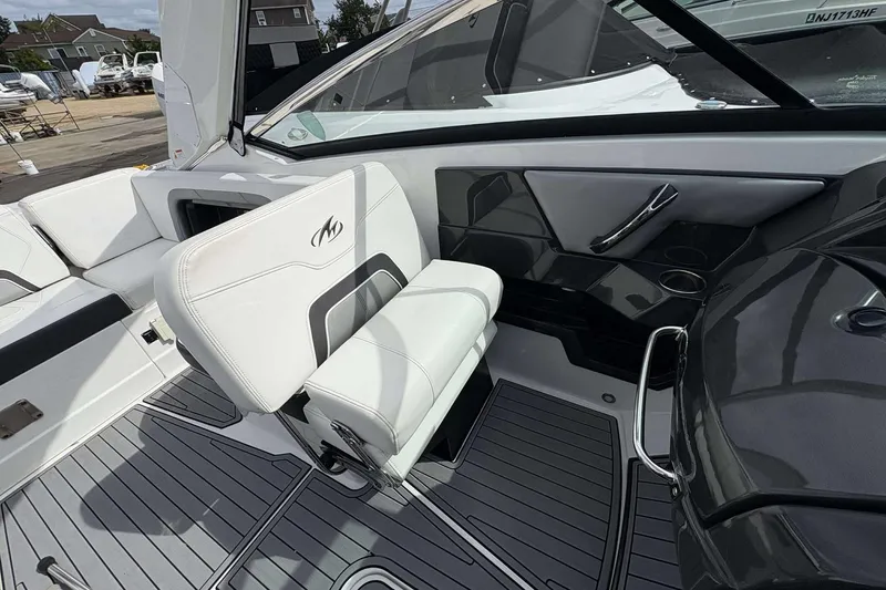 Slide: The Image of 2017 Monterey 298SS boat interior with white seating and sleek design. - 10