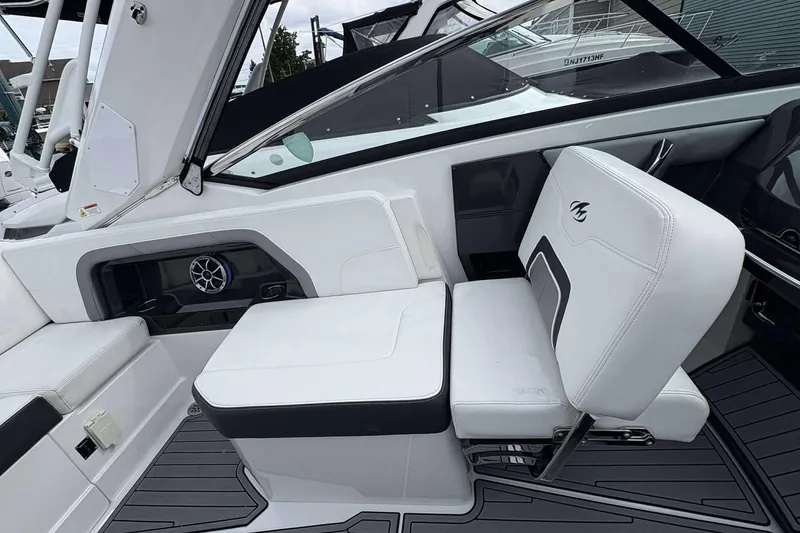 Slide: The Image of 2017 Monterey 298SS boat interior with white seating and speaker system. - 11