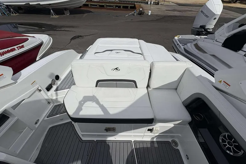 Slide: The Image of 2017 Monterey 298SS boat interior with white seating and deck details. - 12
