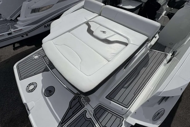 Slide: The Image of 2017 Monterey 298SS boat with white cushioned seating and sleek deck design. - 13