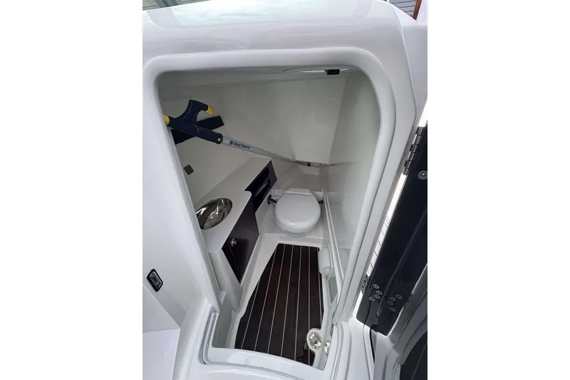 Slide: The Image of 2017 Monterey 298SS boat interior bathroom with toilet and sink. - 18