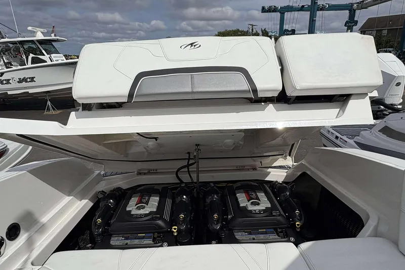 Slide: The Image of Open engine compartment of a 2017 Monterey 298SS boat, showcasing dual engines. - 22