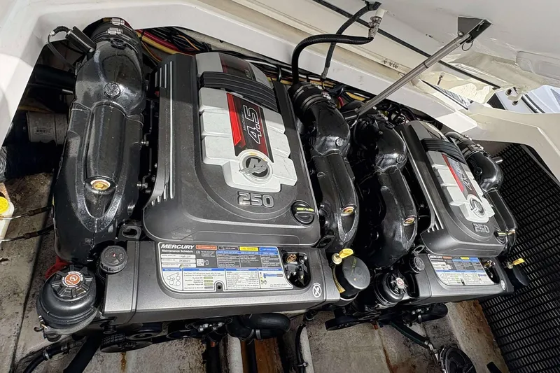 Slide: The Image of Twin Mercury engines in a 2017 Monterey 298SS boat engine compartment. - 23