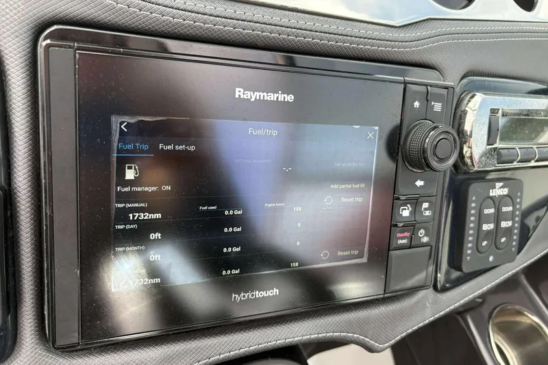 Slide: The Image of Raymarine display on 2017 Monterey 298SS showing fuel trip data and settings. - 25