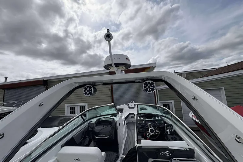 Slide: The Image of 2017 Monterey 298SS boat interior with radar and speakers under cloudy sky. - 3