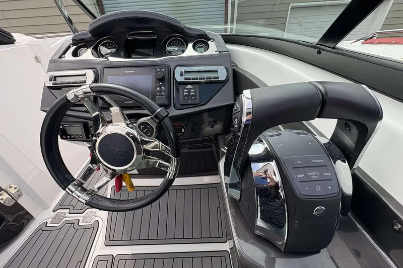 Slide: The Image of Cockpit of 2017 Monterey 298SS boat with steering wheel and control panel. - 7