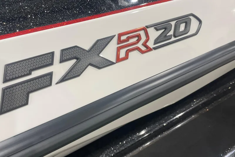 Slide: The Image of 2026 Skeeter FXR20 Apex logo on a sleek, glossy surface. - 1