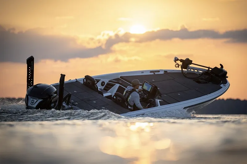 Slide: The Image of Manufacturer Provided Image: 2026 Skeeter FXR20 Apex boat cruising at sunset on a serene lake. - 7
