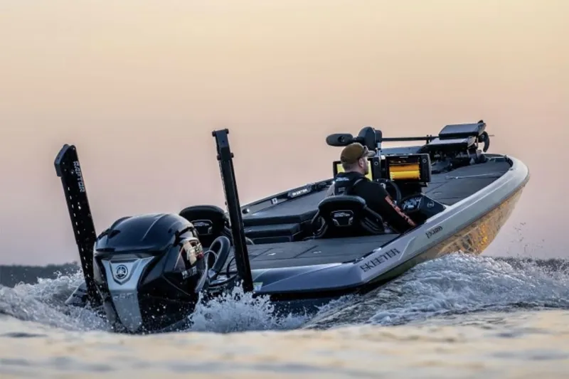 Slide: The Image of Manufacturer Provided Image: 2026 Skeeter FXR20 Apex boat cruising on water at sunset. - 8