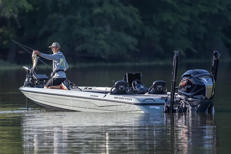 Slide: The Image of Manufacturer Provided Image: 2026 Skeeter FXR20 Apex boat on water with angler holding a fish. - 9