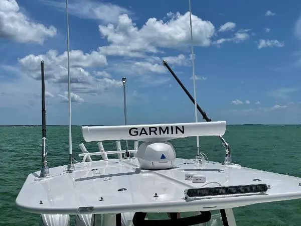 Slide: The Image of 2021 Regulator 34 Center Console boat with Garmin equipment on open water. - 21