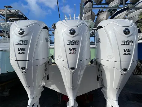Slide: The Image of Triple Yamaha 300 V6 4.2L engines on a 2021 Regulator 34 Center Console boat. - 26