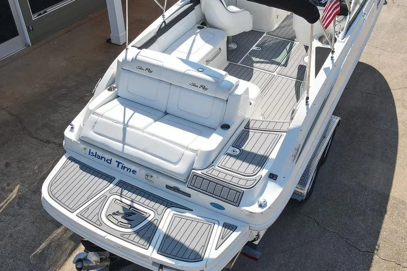 Slide: The Image of 2014 Sea Ray 260 Sundeck boat with white seating and "Island Time" on the stern. - 16