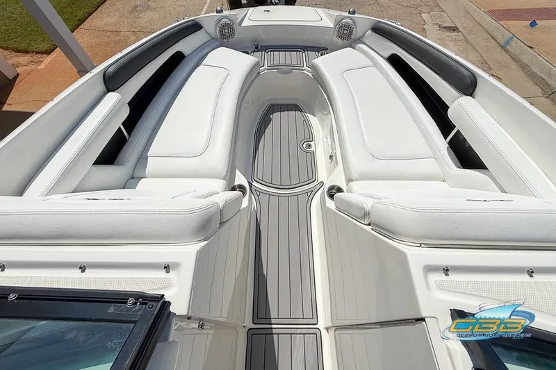 Slide: The Image of 2014 Sea Ray 260 Sundeck boat interior with white seating and gray flooring. - 19