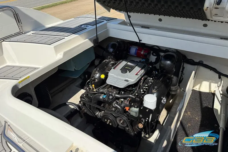 Slide: The Image of 2014 Sea Ray 260 Sundeck engine compartment with visible motor components. - 27