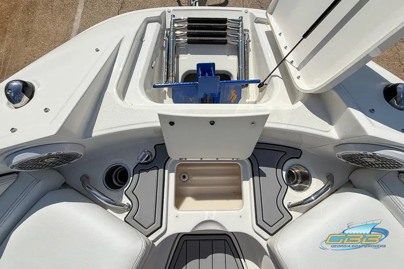 Slide: The Image of 2014 Sea Ray 260 Sundeck boat interior with storage compartment and seating. - 31