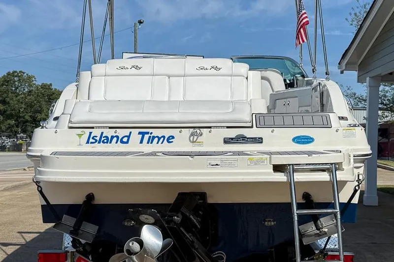 Slide: The Image of 2014 Sea Ray 260 Sundeck boat named "Island Time" with ladder and American flag. - 4