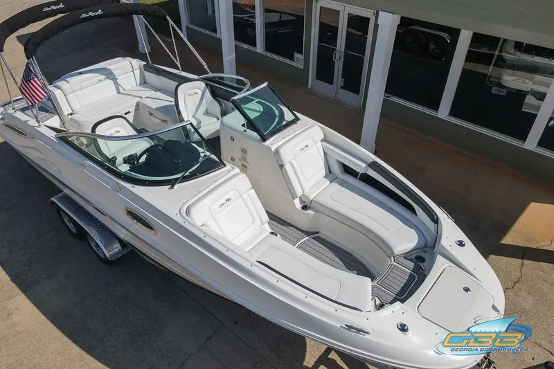 Slide: The Image of 2014 Sea Ray 260 Sundeck boat with sleek white design and spacious seating. - 5