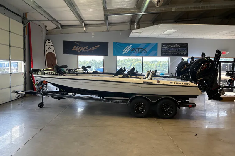 Slide: The Image of 2026 Skeeter ZXE20 boat in showroom, featuring sleek design and dual engines. - 3