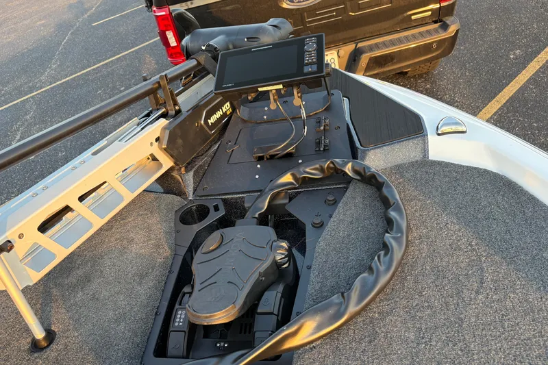 Slide: The Image of 2026 Skeeter ZXE20 boat dashboard with advanced navigation system and steering wheel. - 9