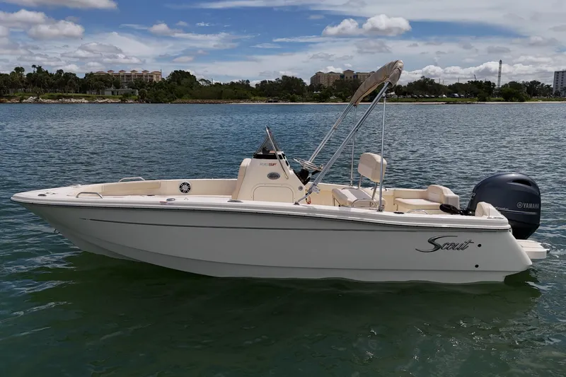 Slide: The Image of 2026 Scout 188 Sportfish boat on calm water, featuring Yamaha outboard motor. - 2