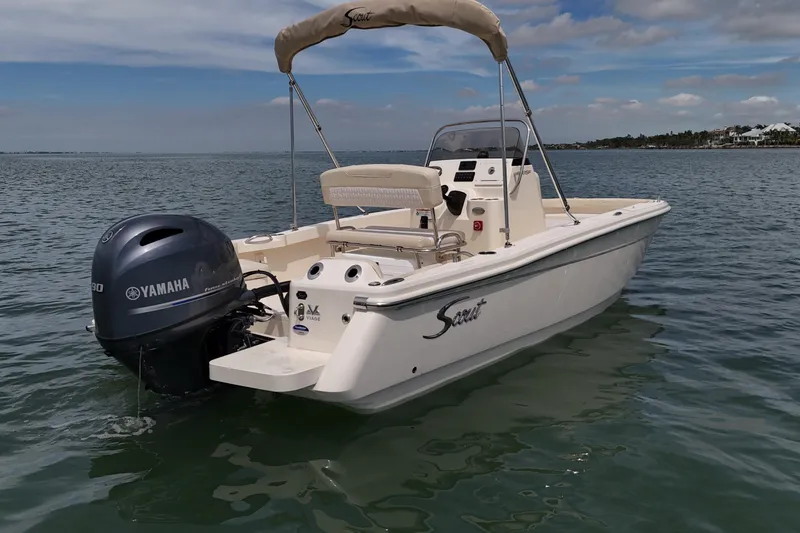 Slide: The Image of 2026 Scout 188 Sportfish boat with Yamaha engine on calm water. - 20