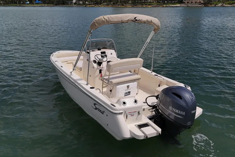 Slide: The Image of 2026 Scout 188 Sportfish boat with Yamaha engine on calm water. - 4