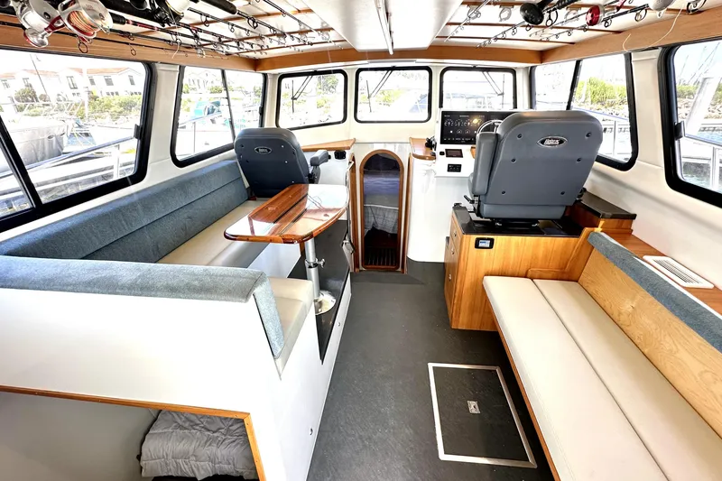 Slide: The Image of 2021 Lindell 42/46 boat helm with Garmin equipment, docked at marina. - 10