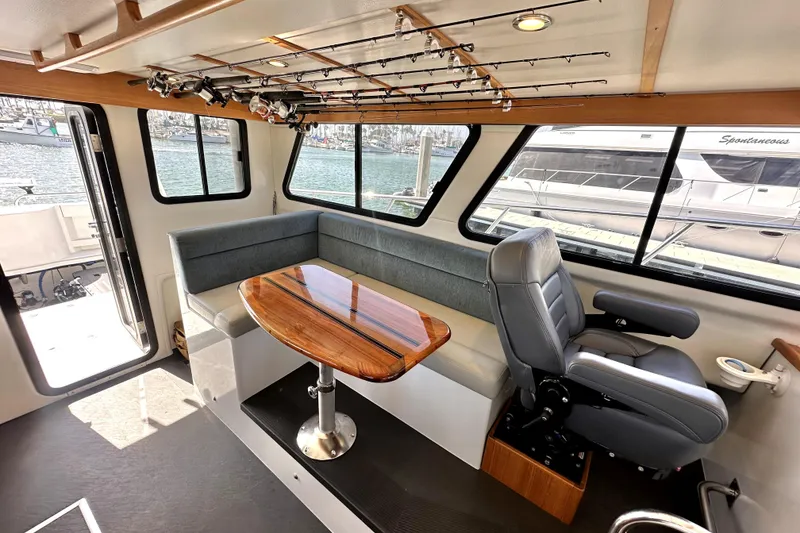 Slide: The Image of Interior of 2021 Lindell 42/46 yacht with seating, table, and cabin view. - 13