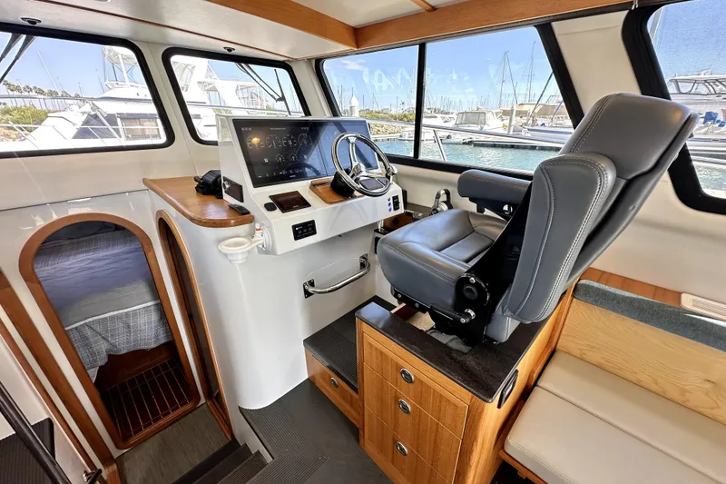 Slide: The Image of Interior of 2021 Lindell 42/46 boat with seating, table, and fishing rods. - 14