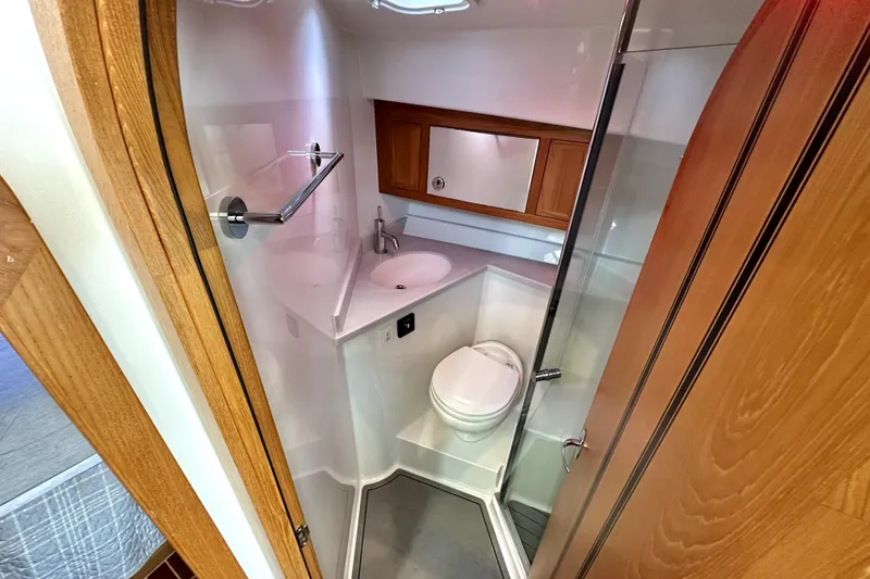 Slide: The Image of Cozy cabin interior of 2021 Lindell 42/46 boat with bed and wooden accents. - 17