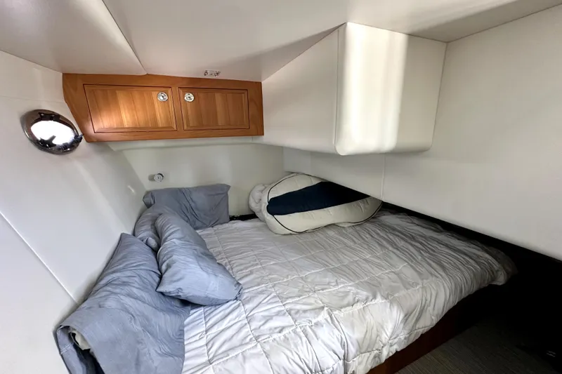 Slide: The Image of Compact bathroom in 2021 Lindell 42/46 boat with modern fixtures and wooden accents. - 18