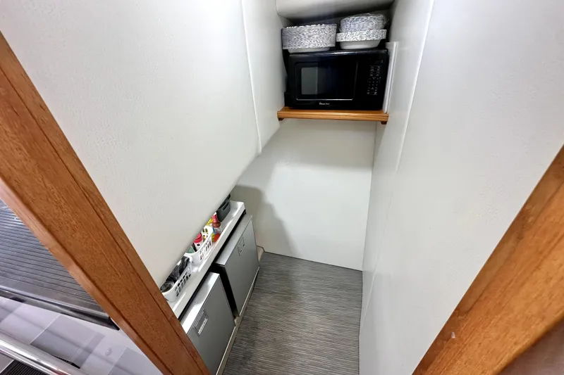 Slide: The Image of Cozy cabin interior of 2021 Lindell 42/46 with bed and wooden cabinets. - 19