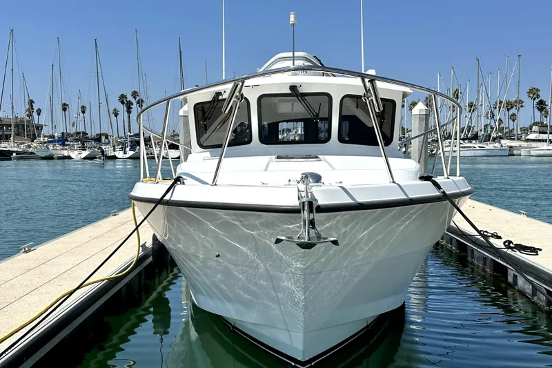Slide: The Image of 2021 Lindell 42/46 yacht docked at marina, clear sky, calm water. - 5