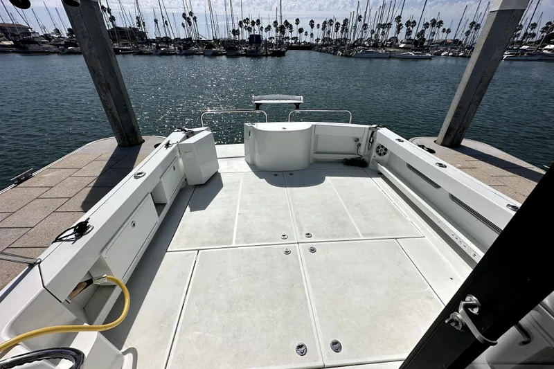 Slide: The Image of 2021 Lindell 42/46 boat docked at marina under clear blue sky. - 7