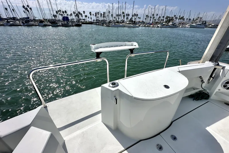 Slide: The Image of Open deck of a 2021 Lindell 42/46 boat docked at a marina. - 8