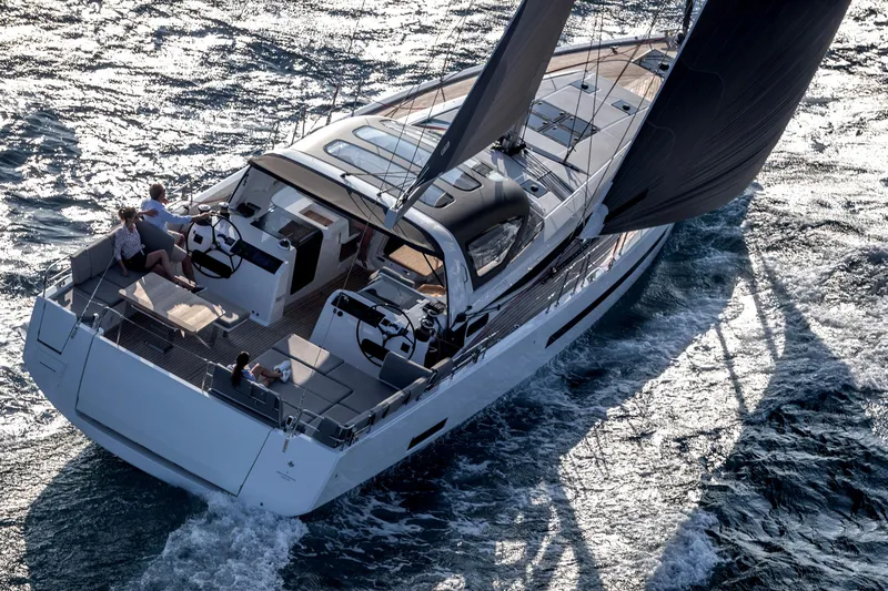 Slide: The Image of 2026 Jeanneau Yachts 55 sailing on open water, showcasing sleek design and modern features. - 4