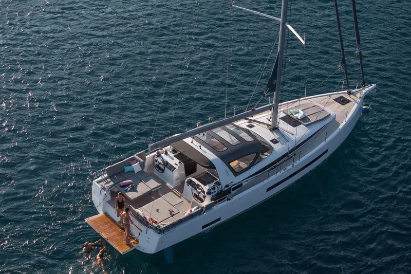 Slide: The Image of 2026 Jeanneau Yachts 55 sailing on open water, featuring a spacious deck and modern design. - 6