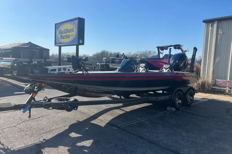 Slide: The Image of 2025 Skeeter ZXR21 boat on trailer at BlackBeard Marine dealership. - 11