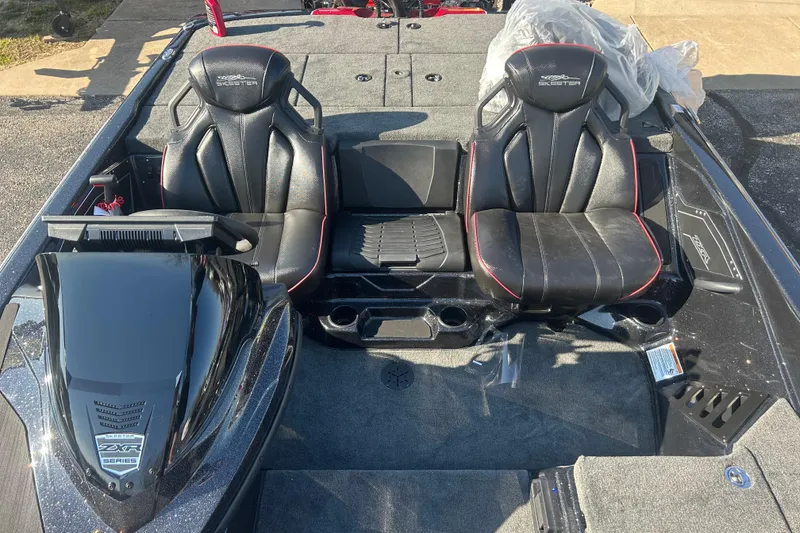Slide: The Image of 2025 Skeeter ZXR21 boat interior with black leather seats and sleek design. - 14