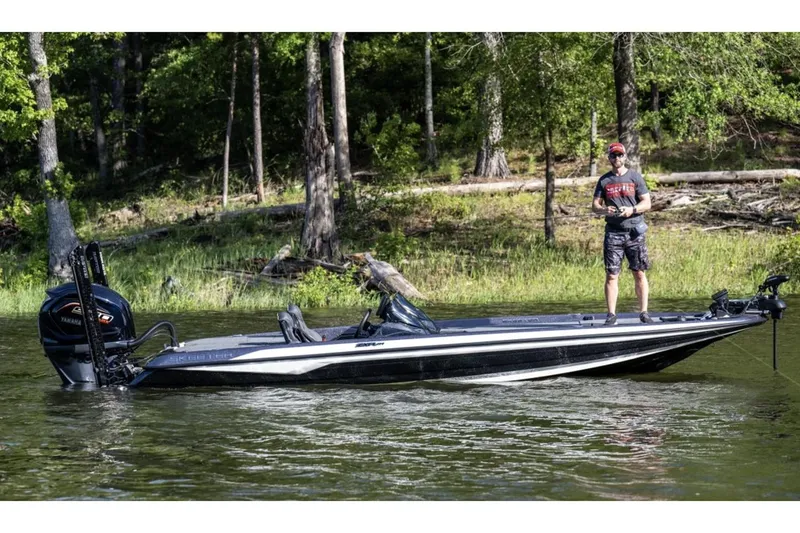 Slide: The Image of Manufacturer Provided Image: Man fishing on a 2025 Skeeter ZXR21 boat in a forested lake. - 19