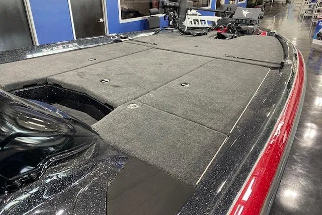 Slide: The Image of 2025 Skeeter ZXR21 boat deck with carpeted surface and storage compartments. - 4