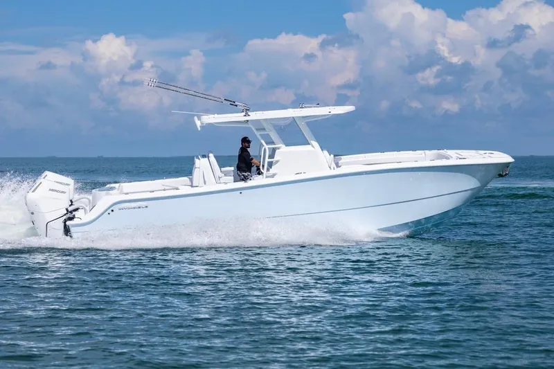 Slide: The Image of 2026 Invincible 33 Catamaran cruising on open water under a clear sky. - 10