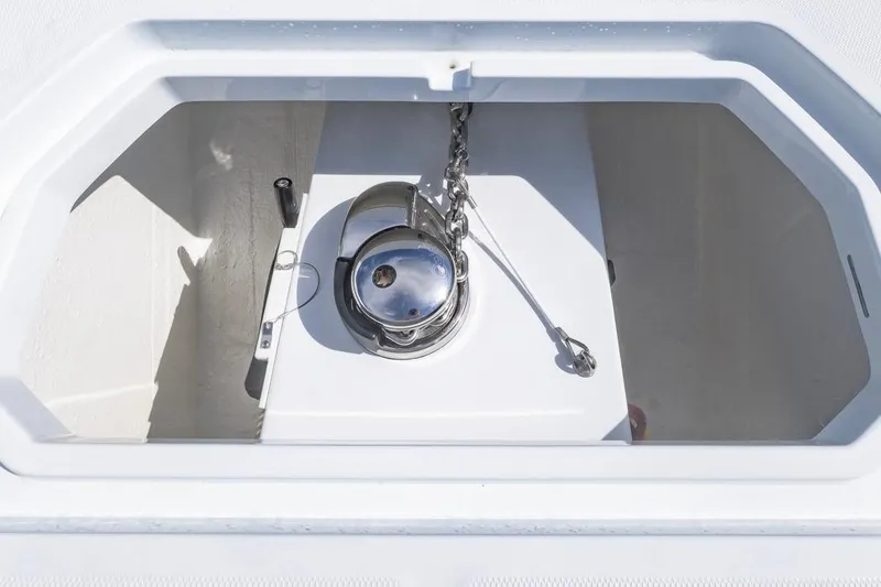 Slide: The Image of Anchor compartment of 2026 Invincible 33 Catamaran with chain and winch. - 13